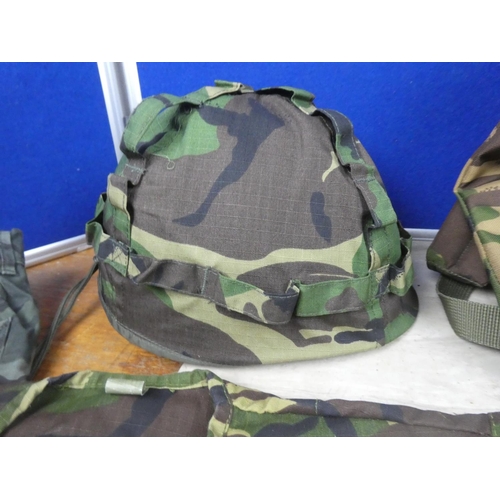 406 - An army camouflage holdall, helmet, water bottle and more.