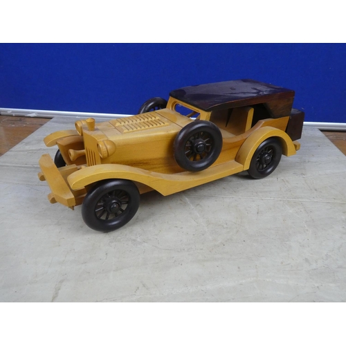 408 - A wooden model vintage car.