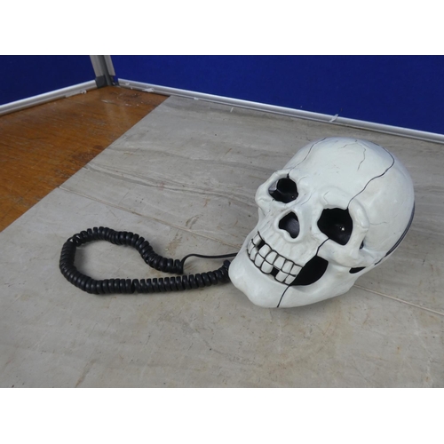 425 - A novelty skull telephone.