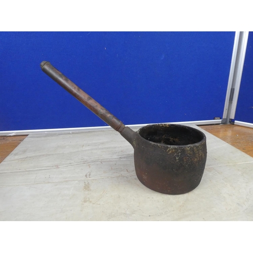 426 - A small antique saucepan with a copper handle.