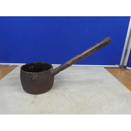 426 - A small antique saucepan with a copper handle.