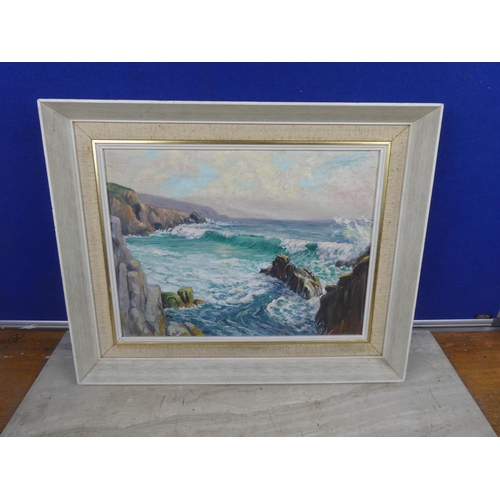 489 - A vintage framed oil painting on board of a costal scene signed.  Approx 44x36cm.