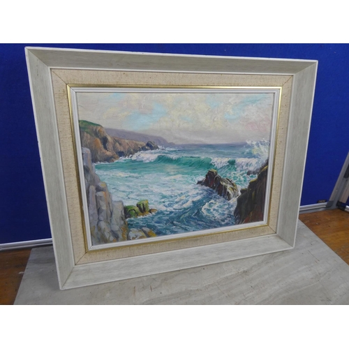 489 - A vintage framed oil painting on board of a costal scene signed.  Approx 44x36cm.