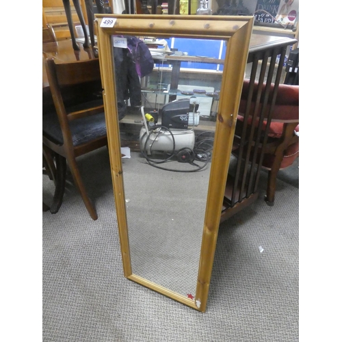 499 - A pine framed mirror.  Approx 38x98cm.