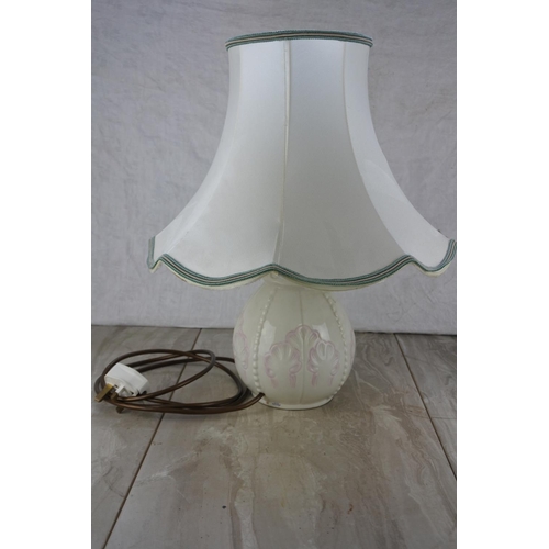 679 - A Belleek pottery table lamp base and shade.  Approx 45cm.