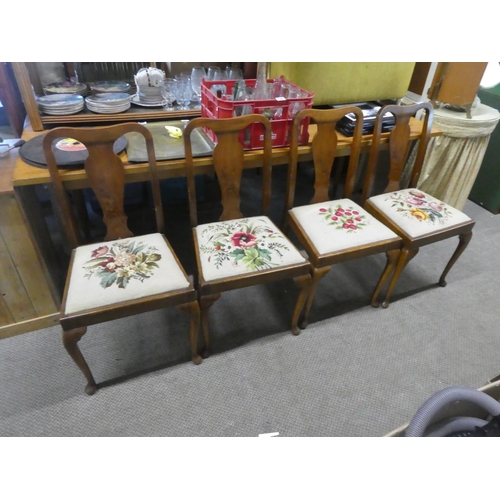 705 - A stunning set of four mahogany framed chairs with tapestry upholstered seats.