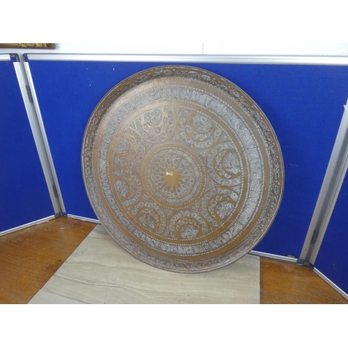 722 - A very large decorative brass charger.  Approx 59cm.