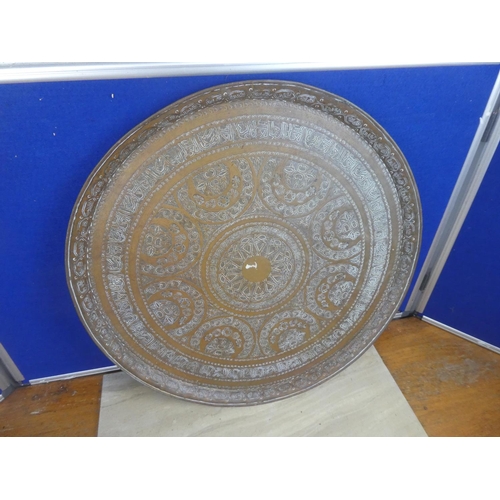 722 - A very large decorative brass charger.  Approx 59cm.