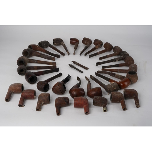 A large collection of vintage and antique pipes to include a Loewe