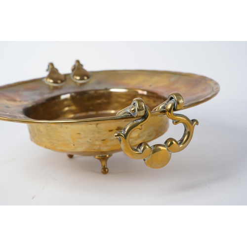 12 - A stunning antique two handled brass centre piece, measuring 30cm x 27cm x 9cm.