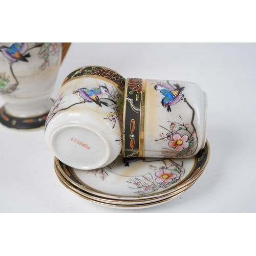 19 - An Oriental patterned coffee set with repairs to the milk jug.