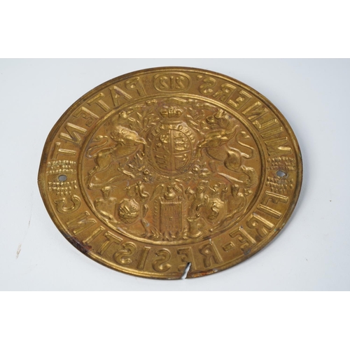 26 - A vintage Milners brass plaque, measuring 17cm diameter.
