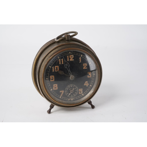 27 - A vintage travel alarm clock, measuring 11cm.