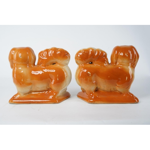 28 - A pair of antique Pekinese mantle dogs (a/f), measuring 20cm x 23cm.