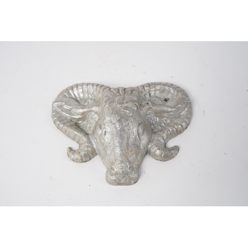 32 - A Rams head metal plaque.