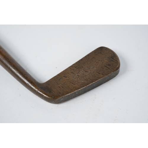 4 - An antique U Kendall brass head golf club.