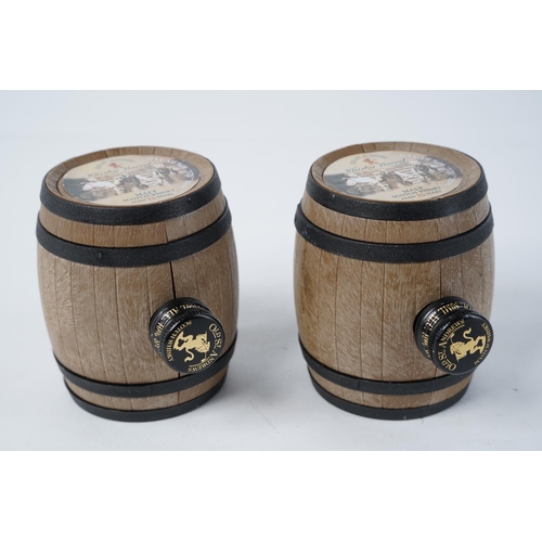 44 - Two small Old St Andrews Scotch Whisky decanter barrels, measuring 7cm.