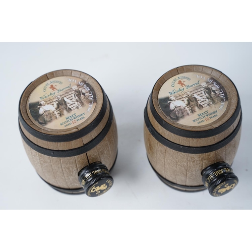 44 - Two small Old St Andrews Scotch Whisky decanter barrels, measuring 7cm.