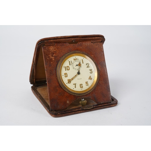 52 - A vintage leather cased 8 day travel clock.