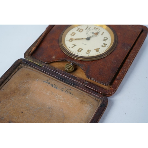 52 - A vintage leather cased 8 day travel clock.