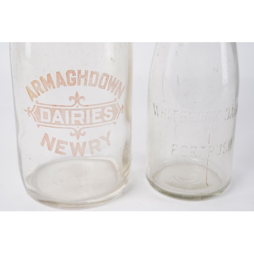 57 - A large Armaghdown Dairies, Newry milk bottle and another for Whiterock Dairies, Portrush, largest m... 