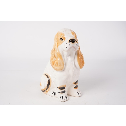 63 - A ceramic dog money box, measuring 21cm.