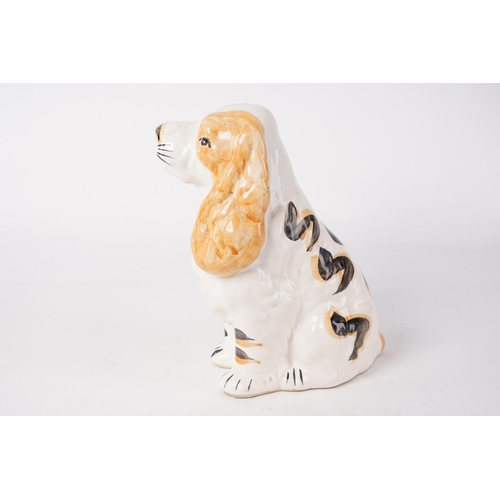 63 - A ceramic dog money box, measuring 21cm.