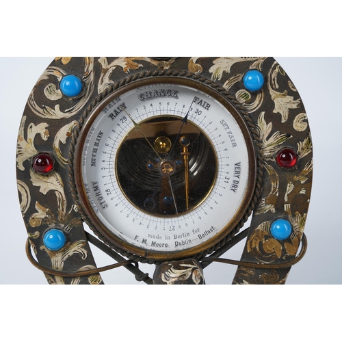 73 - An unusual vintage metal and gilt barometer in the style of a horseshoe, made for F M Moore, Dublin ... 