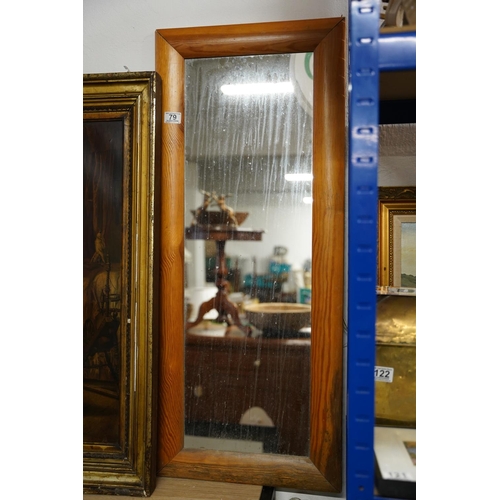 79 - A pine framed mirror, measuring 103cm x 43cm.