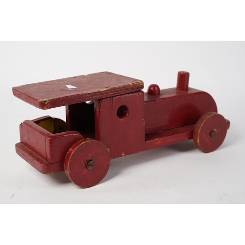 80 - A vintage wooden toy train, measuring 28cm.