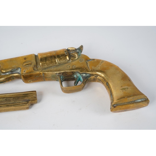 86 - A pair of large heavy brass ornamental pistols, measuring 31cm.