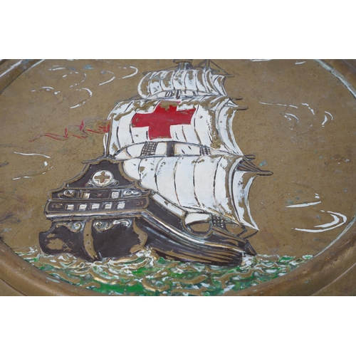 99 - A metal and painted plaque of a sailing ship, measuring 46cm.