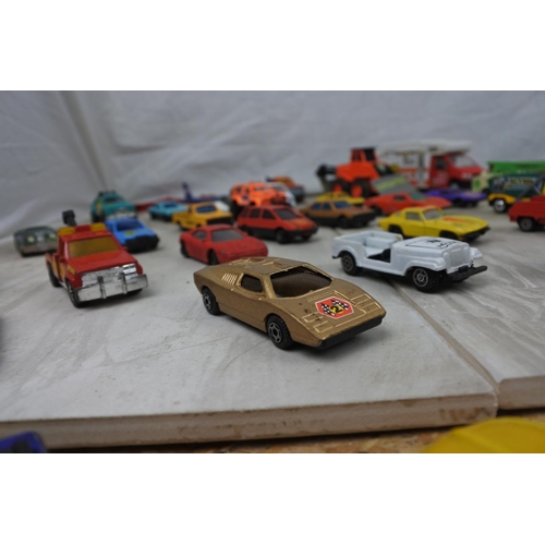 102 - A job lot of assorted Matchbox toy vehicles and more.