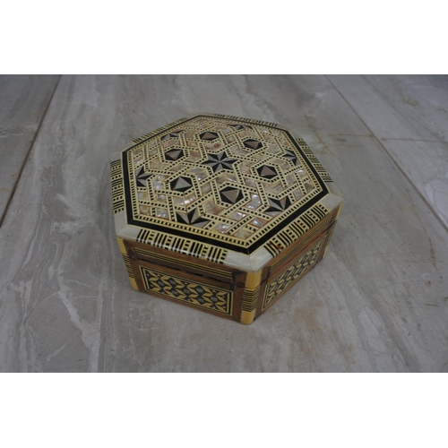 109 - A stunning mother of pearl and wood trinket box.