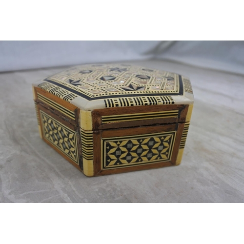 109 - A stunning mother of pearl and wood trinket box.