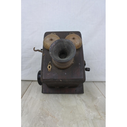 116 - An antique wall mounted telephone base unit, Approx 17x15x17cm.