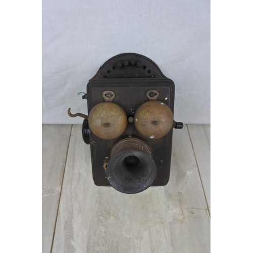 116 - An antique wall mounted telephone base unit, Approx 17x15x17cm.