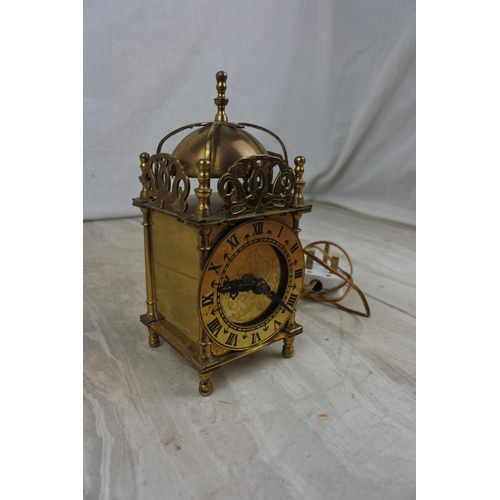 117 - An electrified antique brass mantle clock, Approx 17cm in height.