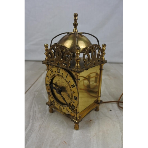 117 - An electrified antique brass mantle clock, Approx 17cm in height.