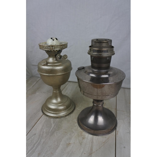 119 - A vintage Aladdin No 21 oil lamp base and another, Approx 31cm in height.