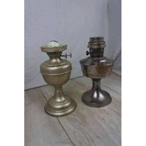 119 - A vintage Aladdin No 21 oil lamp base and another, Approx 31cm in height.