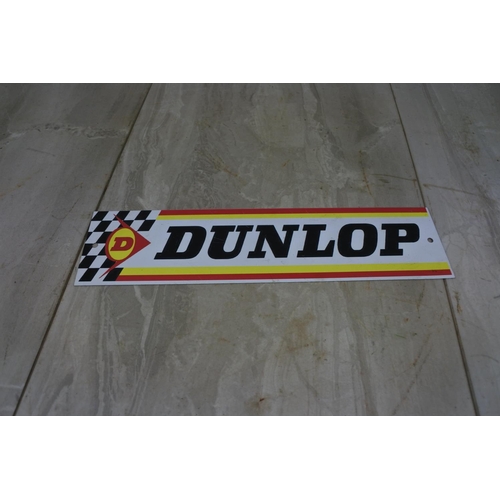 123 - A Dunlop advertising plaque, Approx 30x8cm.