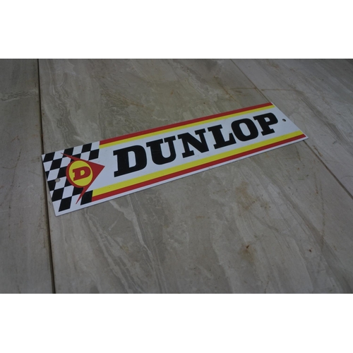 123 - A Dunlop advertising plaque, Approx 30x8cm.