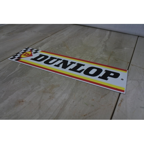 123 - A Dunlop advertising plaque, Approx 30x8cm.