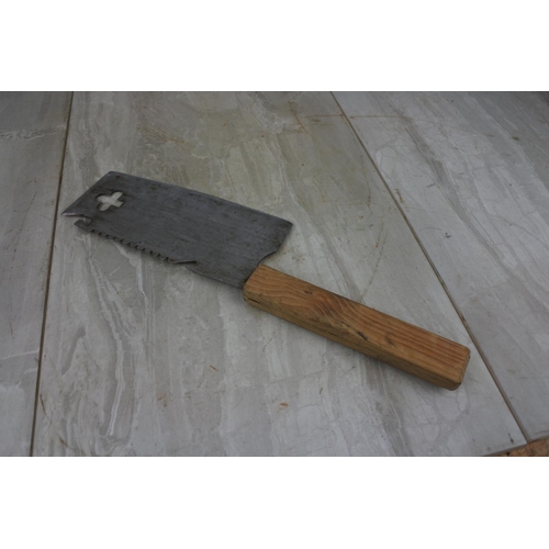 125 - A wooden handled meat cleaver with cut out detail.