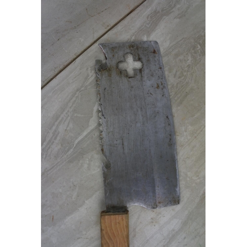 125 - A wooden handled meat cleaver with cut out detail.