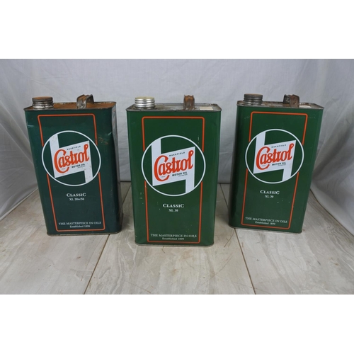 132 - Three Castrol oil cans.