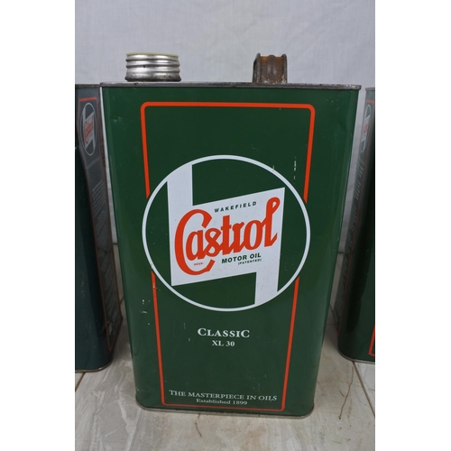 132 - Three Castrol oil cans.