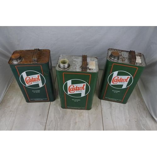 132 - Three Castrol oil cans.