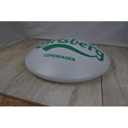 136 - A Carlsberg light cover, Approx 38cm in diameter.